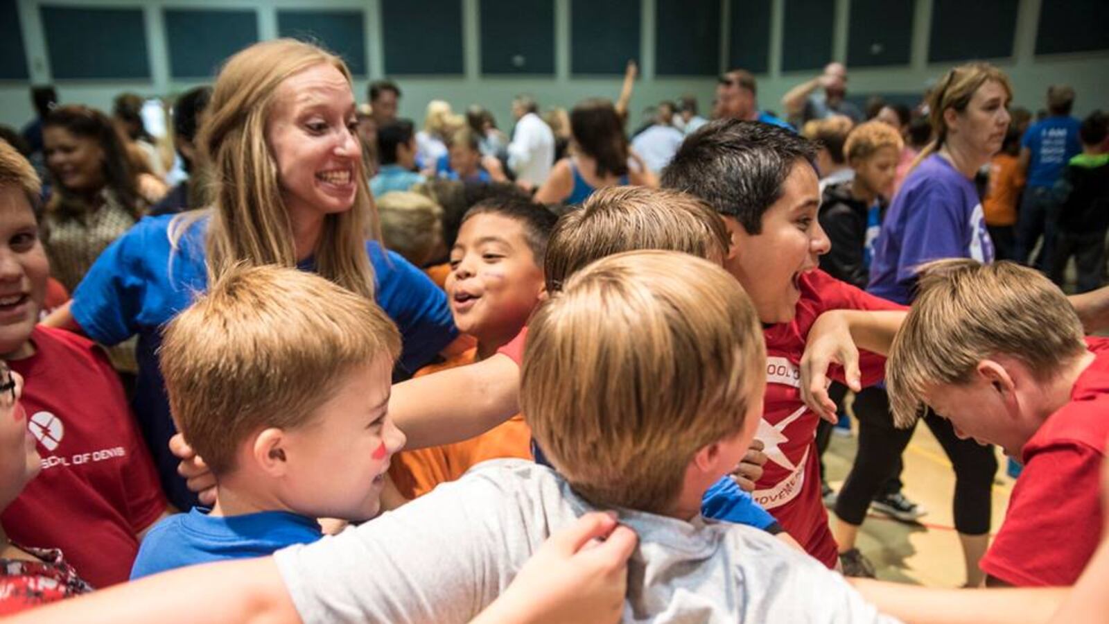 Students at The Boys School of Denver play a game with a teacher on the first day of school in August 2017.