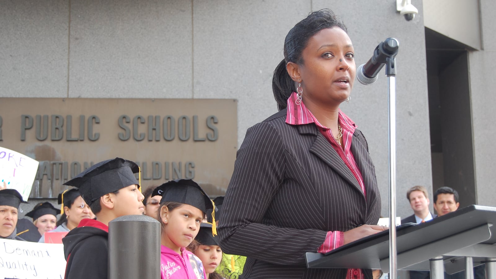 DPS parent MiDian Holmes spoke at a Thursday rally supporting the district's reform proposals.