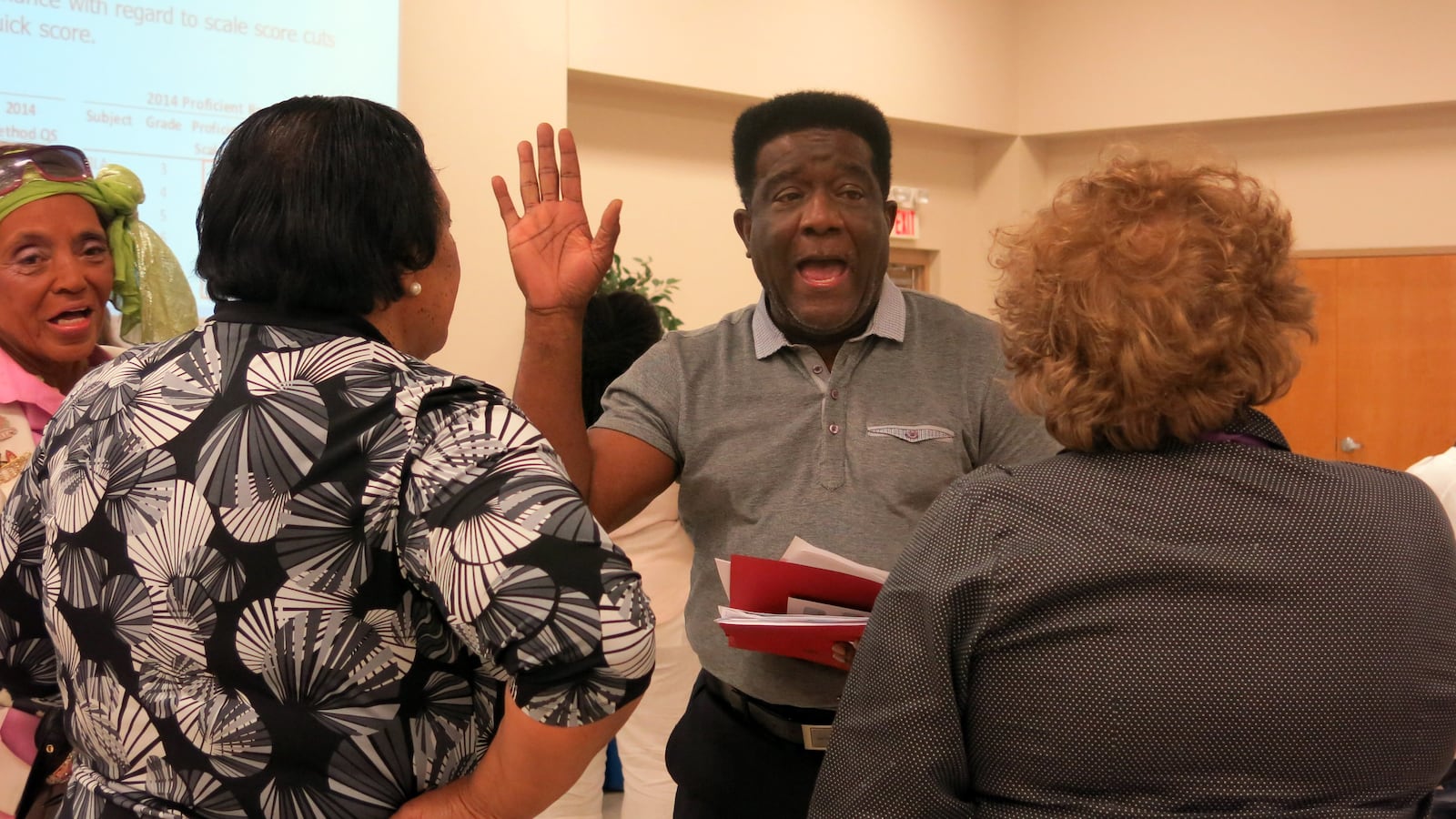 Outgoing MSCEA President Keith Williams talks with teachers in June after meeting with a state education official over confusing TCAP score results.