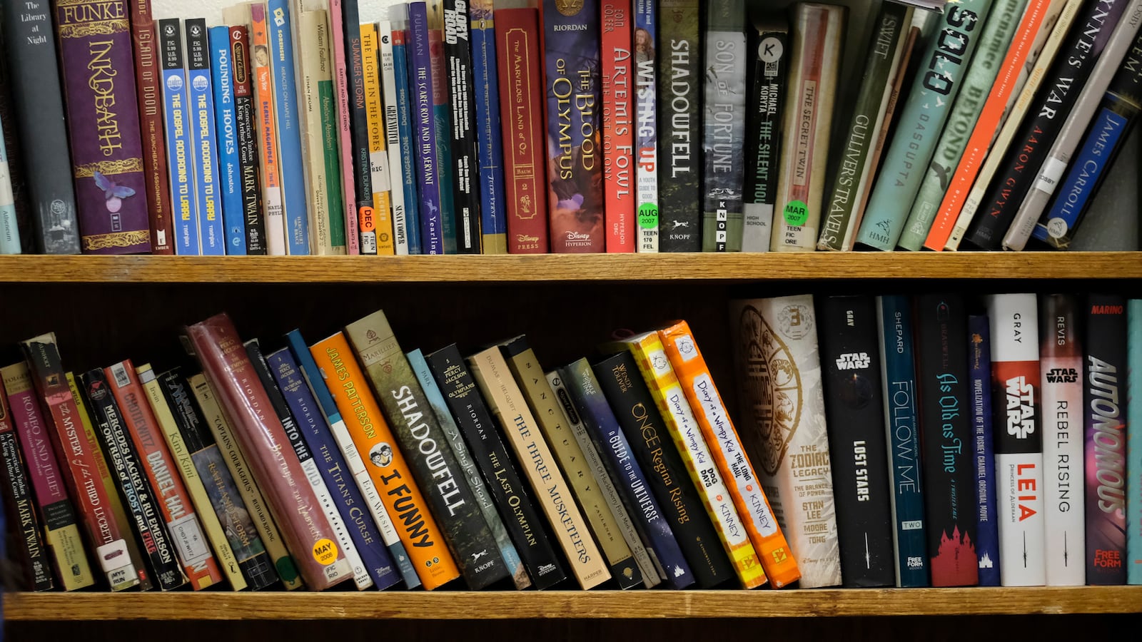Books on a shelf in a classroom at Crispus Attucks High School, a public school in Indianapolis, Indiana. — April 2019 — Photo by Alan Petersime/Chalkbeat