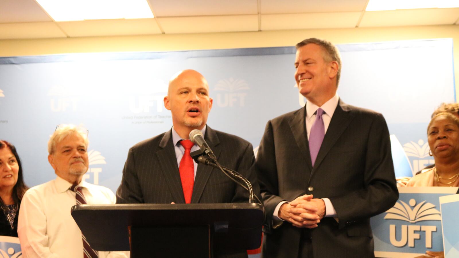 United Federation of Teachers President Michael Mulgrew, center, and Mayor Bill de Blasio