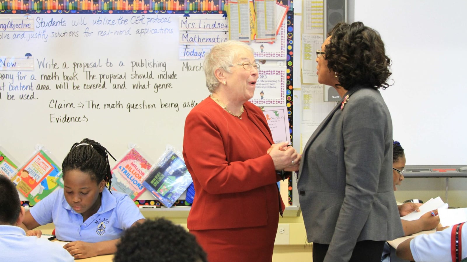 Chancellor Carmen Fariña speaks with Monique Campbell, the principal of The School of Integrated Learning, one of the city schools that will begin absorbing a struggling middle school next year.