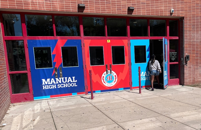 Blue and red doors to a school.
