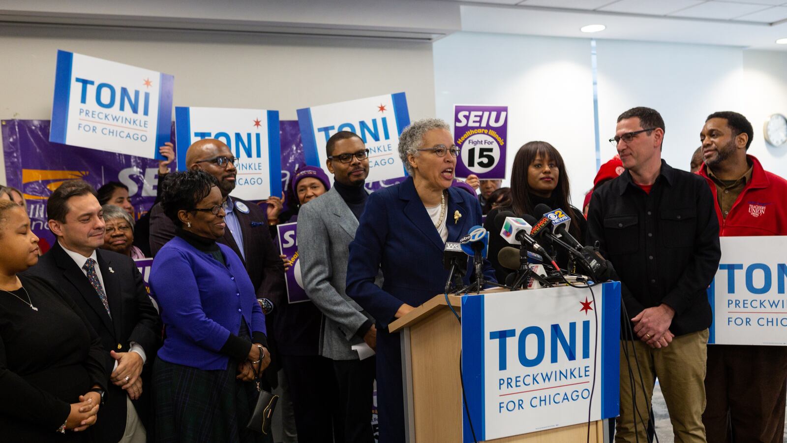 In December, Toni Preckwinkle recieved endorsements from three powerful progressive unions, including the Chicago Teachers Union, whose vice president Stacey Gates and president Jesse Sharkey are standing right of the podium.