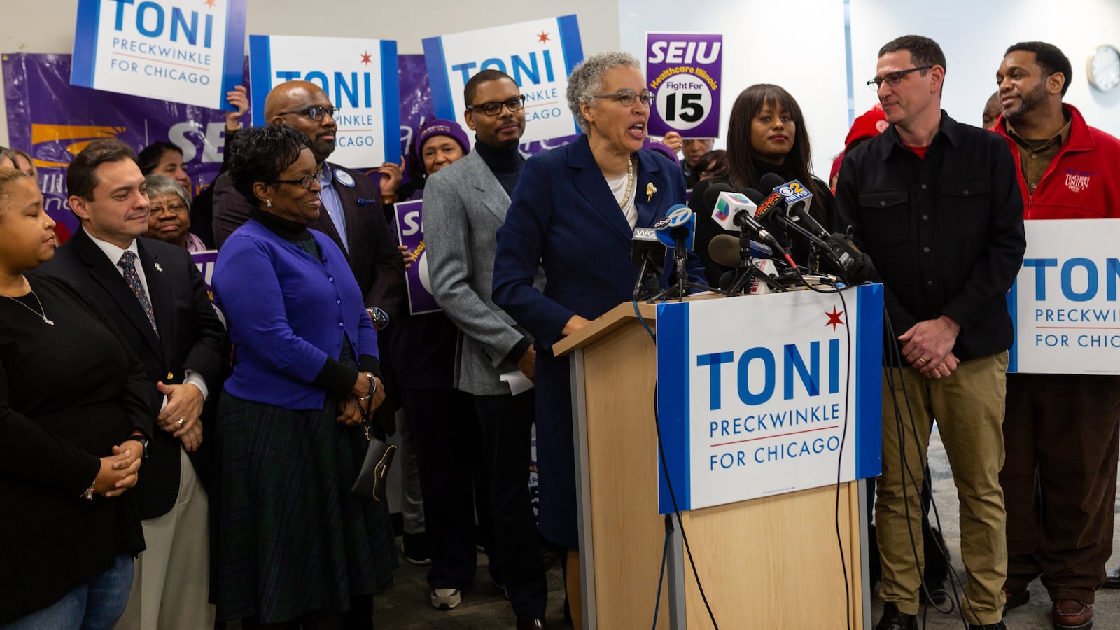 In December, Toni Preckwinkle recieved endorsements from three powerful progressive unions, including the Chicago Teachers Union, whose vice president Stacey Gates and president Jesse Sharkey are standing right of the podium.