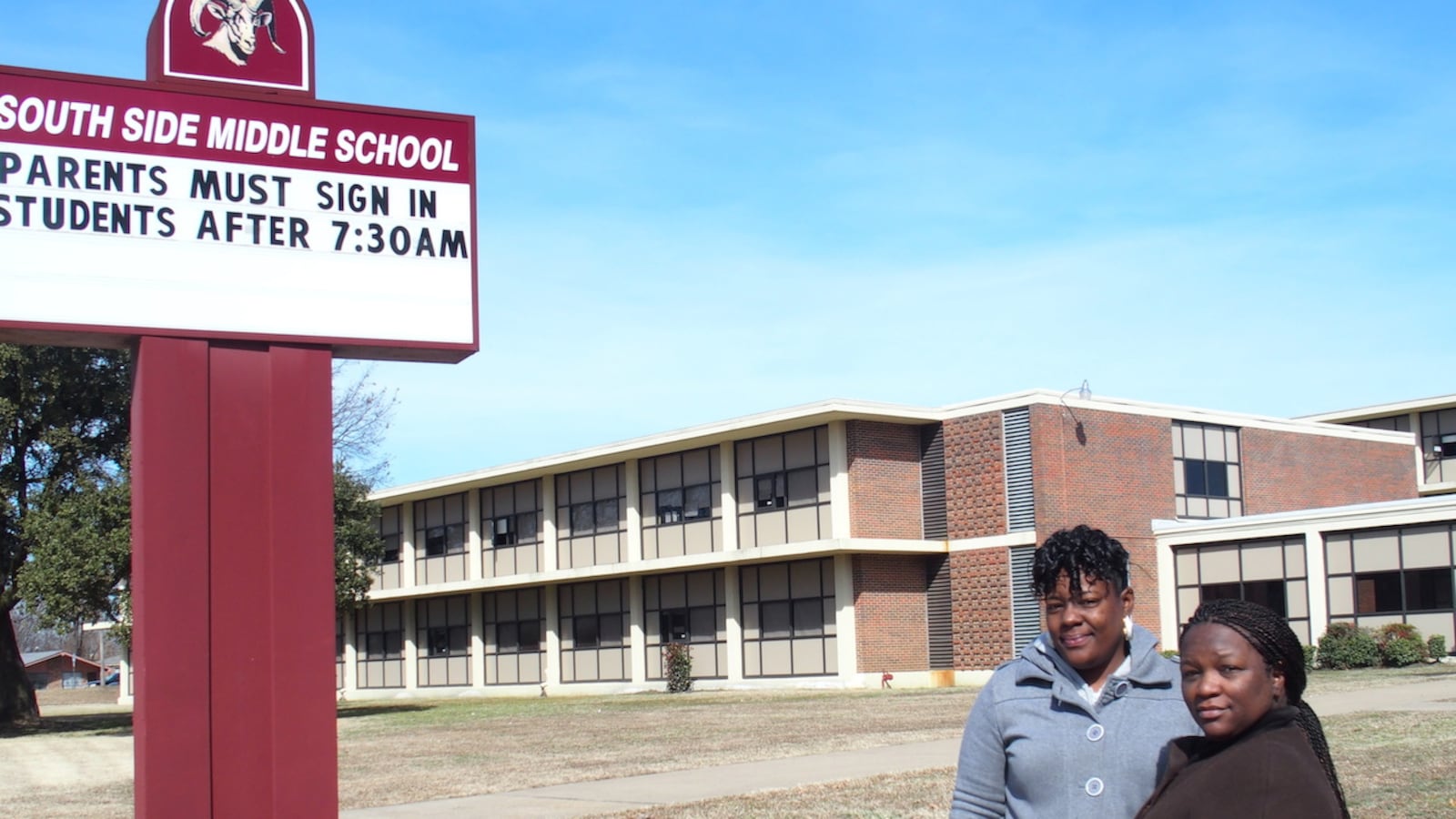 From left: Parents Charlotte Smith and Nadia Holmes stand in front of South Side Middle before the South Memphis school  was shuttered in 2015. The decision by leaders of Shelby County Schools impacted 300 students.