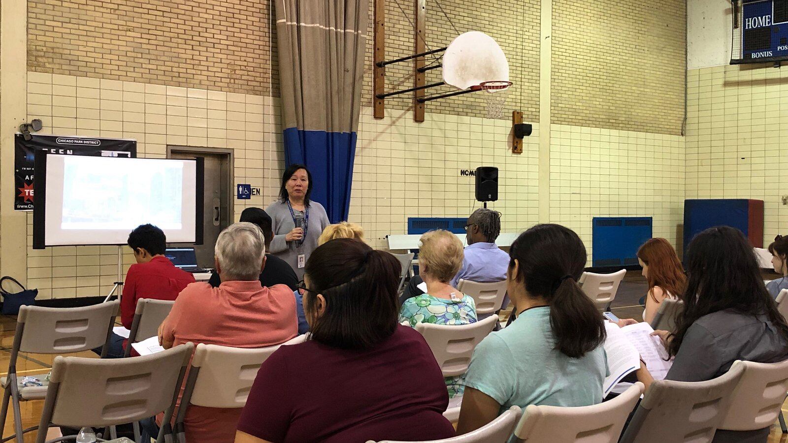 Chicago Public Schools’ safety and security chief Jadine Chou speaks at a community meeting on Chicago’s school police program.