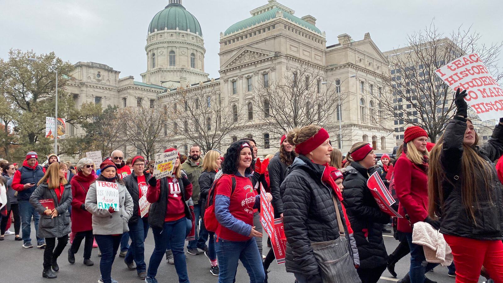 Red for Ed supporters march up Capitol Avenue around the Indiana Statehouse on Tuesday, Nov. 19, 2019.
